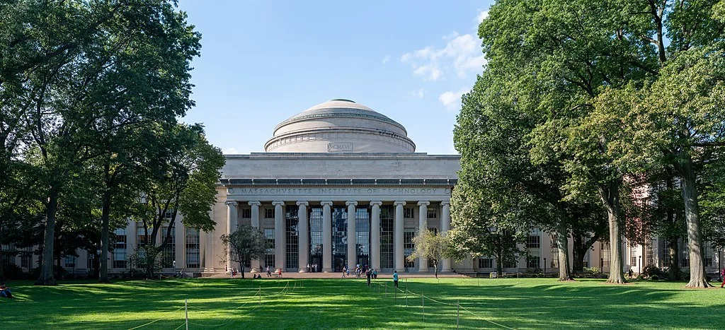 MIT Great Dome on a sunny day with trees and lawn in foreground