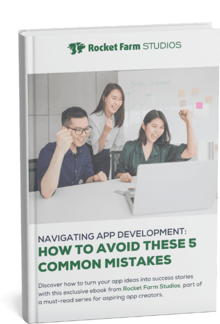 Ebook cover titled 'Navigating App Development: How to Avoid These 5 Common Mistakes' by Rocket Farm Studios, featuring a team celebrating success in an office setting.