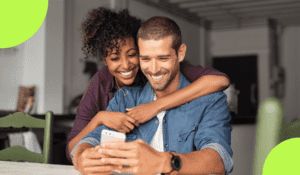 Couple hugging while on the phone.